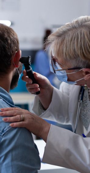 close-up-physician-using-otoscope-ear-consultation-with-patient-woman-otologist-checking-infection-with-otolaryngology-instrument-medical-visit-during-coronavirus-pandemic.jpg